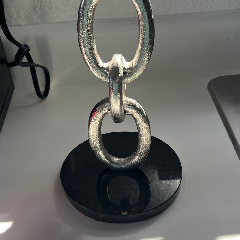 Silver Chain Link Sculpture on Black Marble Base